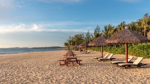 Private beach, white sand, free beach cabanas, beach bar