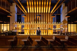 2 bars/lounges, poolside bar, beach bar