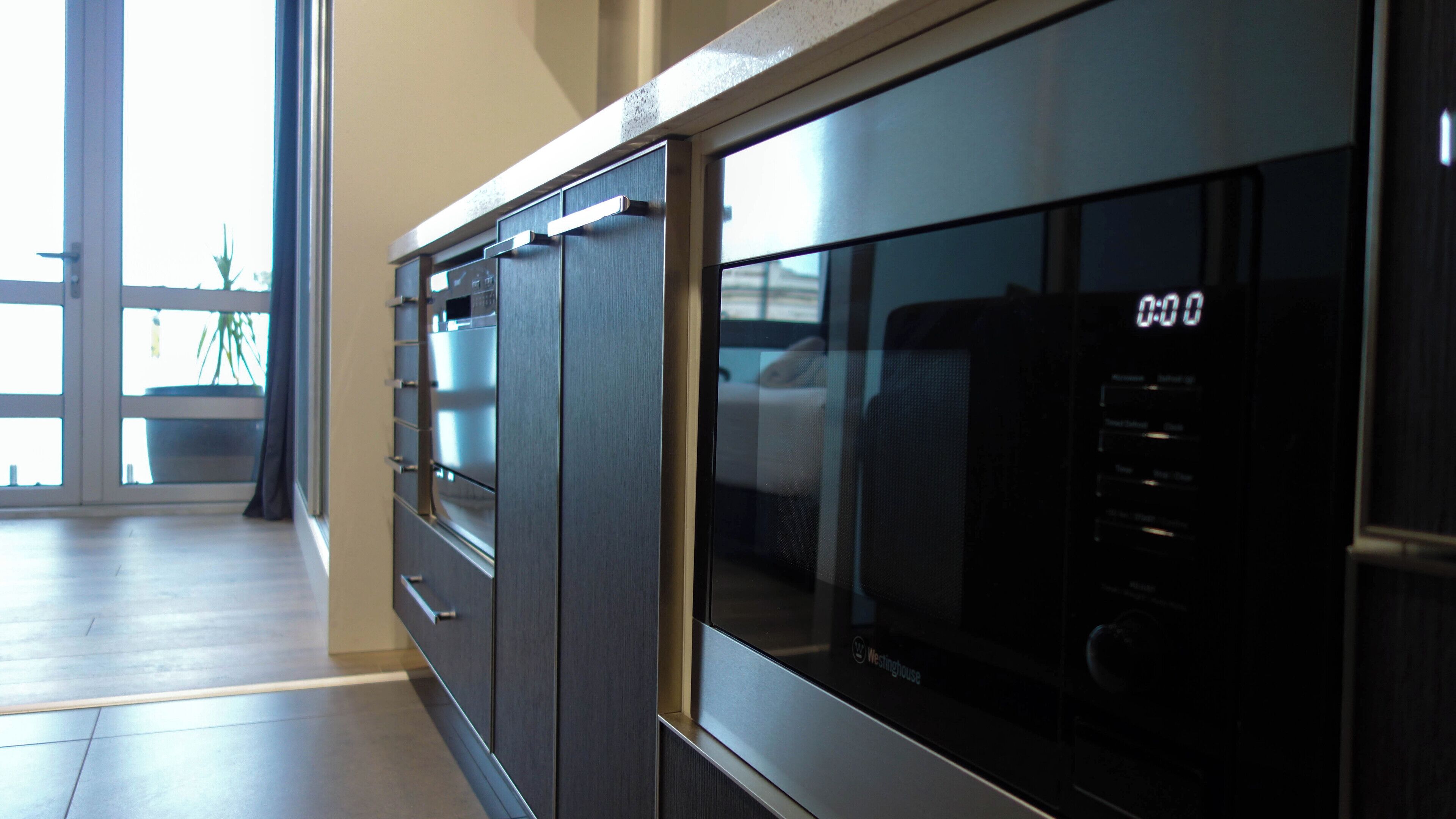 full-sized fridge, microwave, stovetop, dishwasher