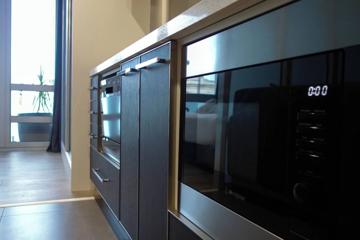 full-sized fridge, microwave, stovetop, dishwasher