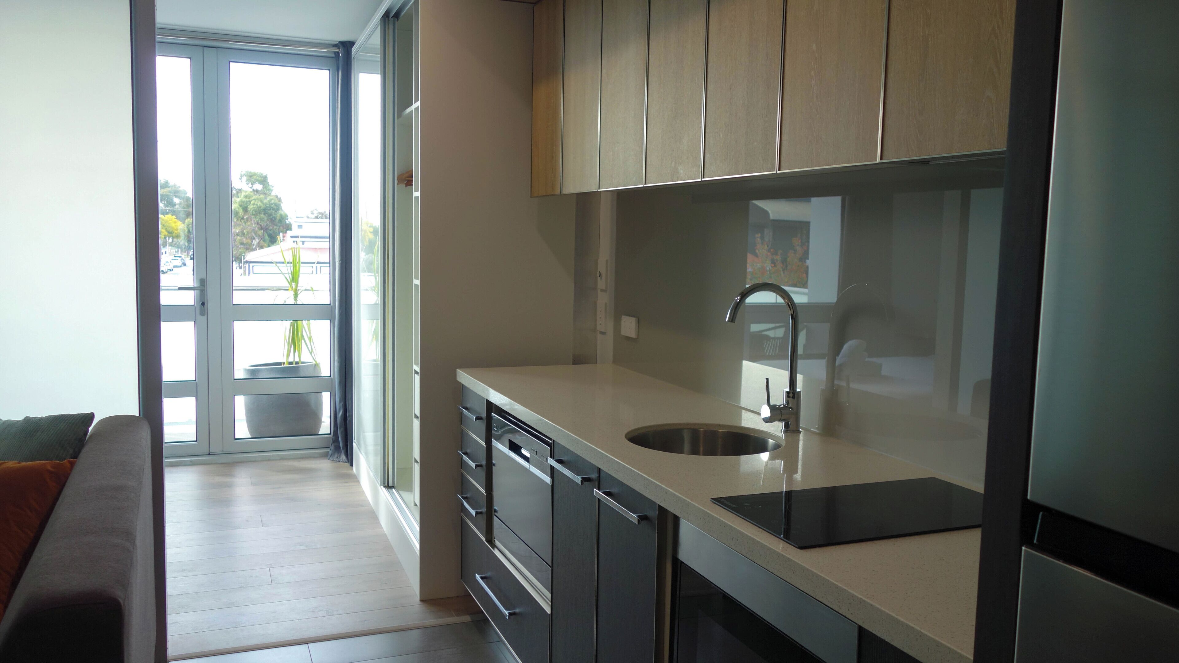 full-sized fridge, microwave, stovetop, dishwasher