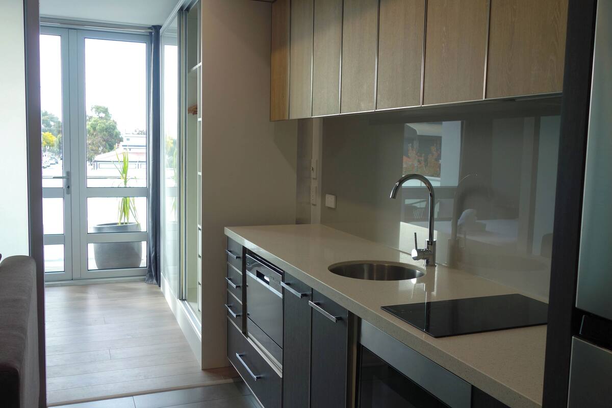 full-sized fridge, microwave, stovetop, dishwasher