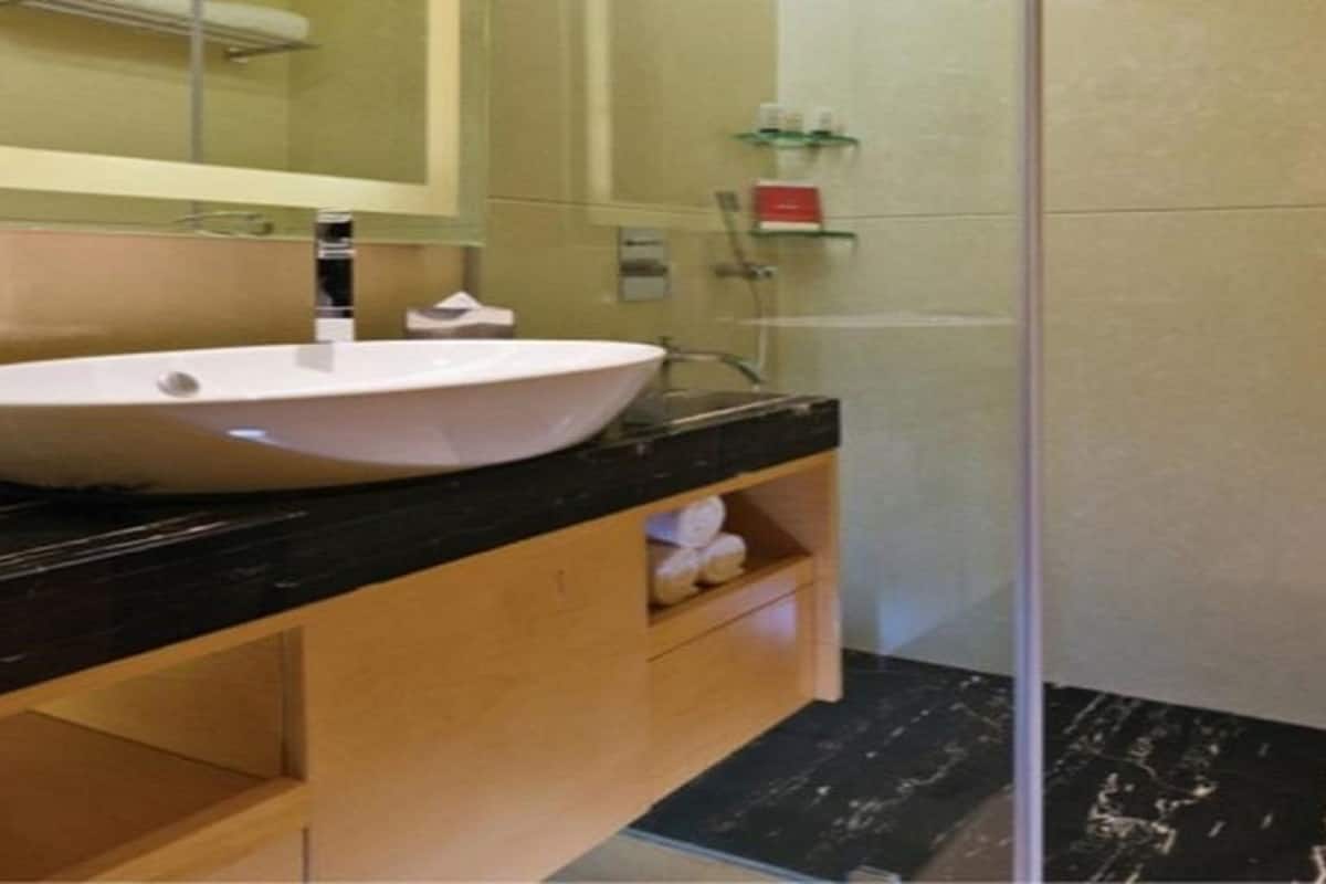 premium room | bathroom | shower, free toiletries, hair dryer, bathrobes