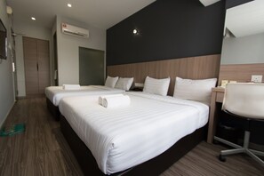 A hotel room with two beds, a desk, and a chair. - Hotel 99 - SS2 (Petaling Jaya)