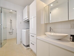 Separate tub and shower, free toiletries, hair dryer, slippers