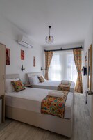 Triple Room, Garden View | Egyptian cotton sheets, premium bedding, minibar, desk