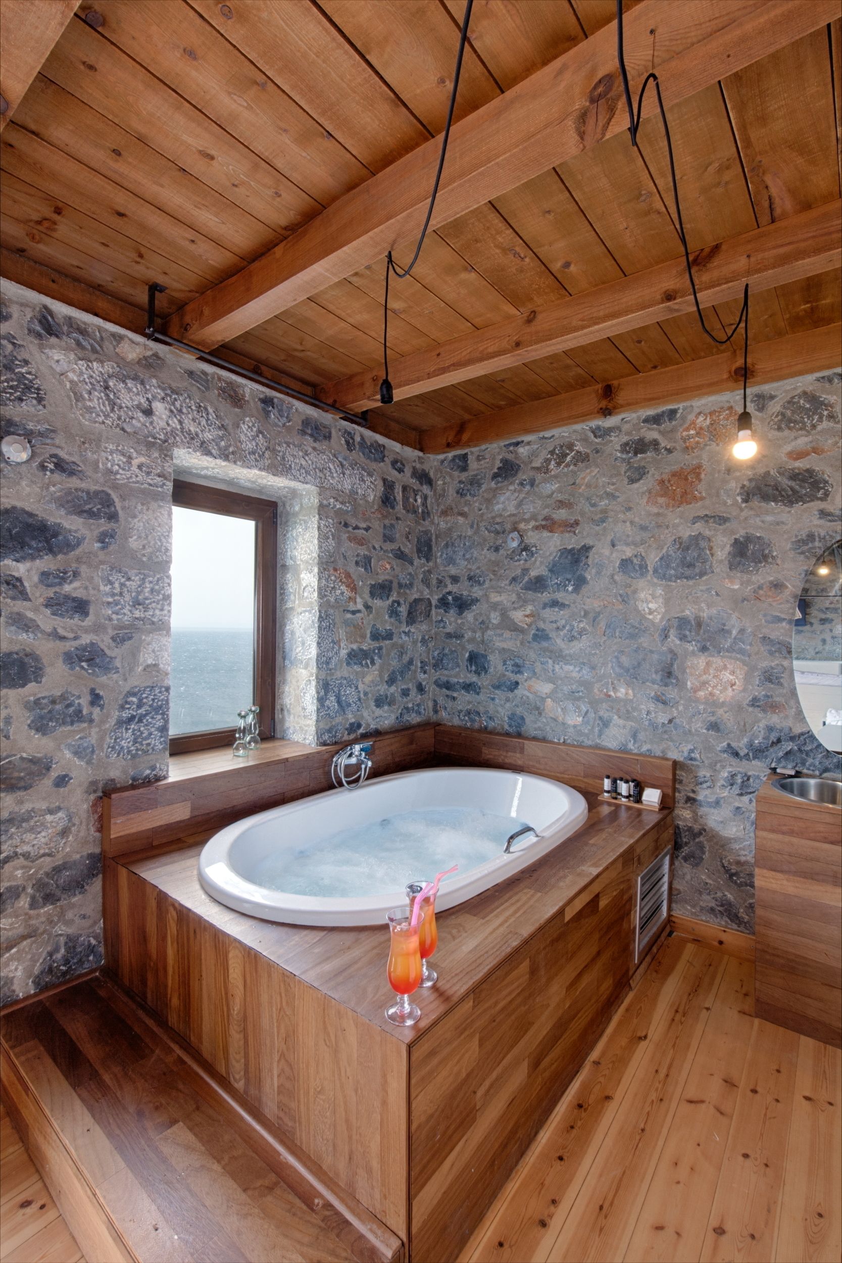 deluxe suite, sea view | bathroom | rainfall showerhead, designer toiletries, hair dryer, slippers