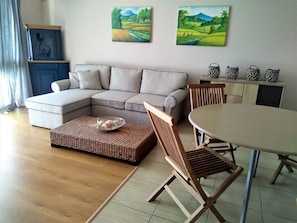 Apartment, 1 Bedroom, Garden View, Courtyard Area | Living room | Flat-screen TV