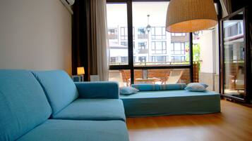 Design Apartment, 1 Bedroom, Terrace, Poolside | Living room | Flat-screen TV