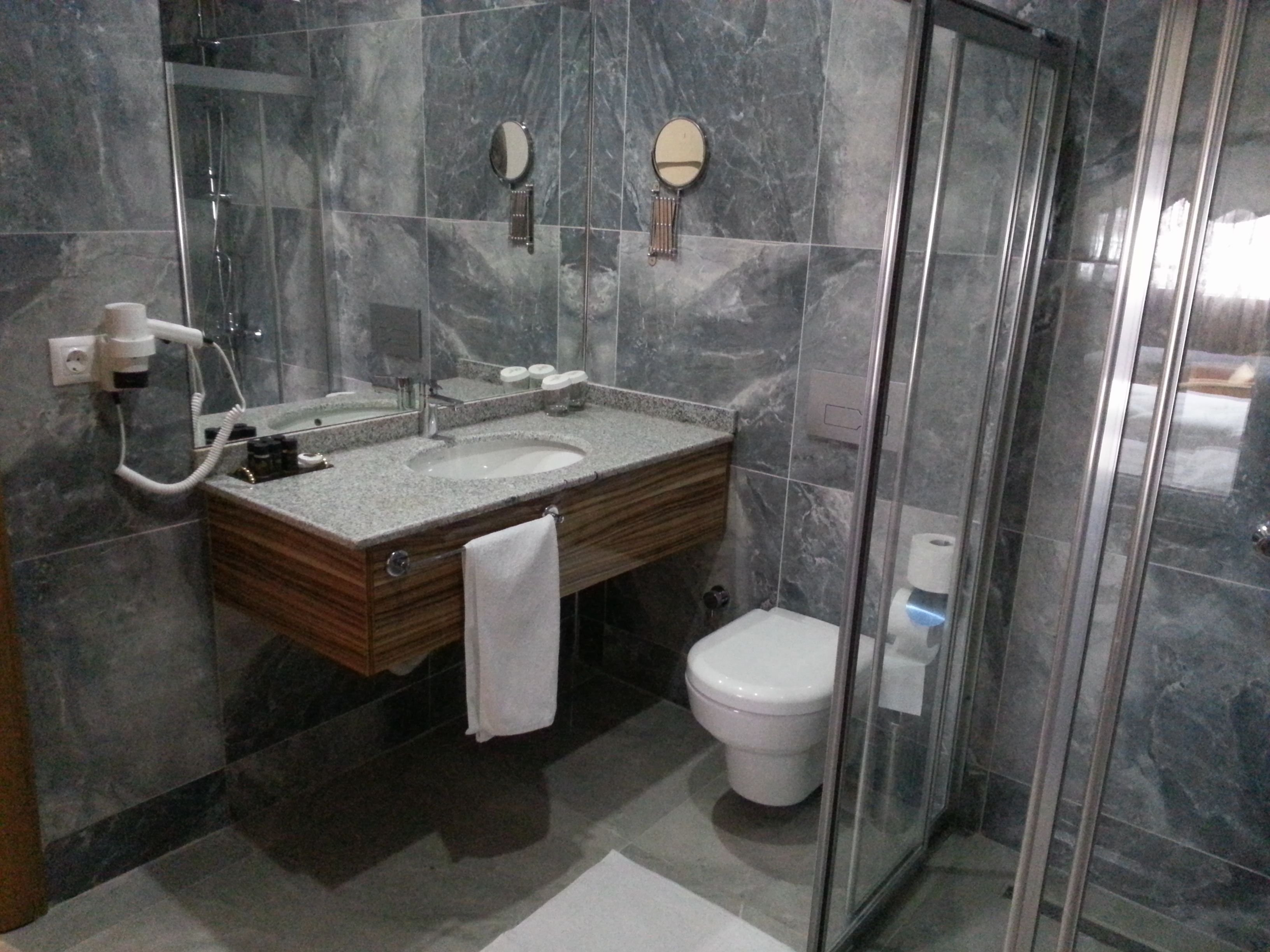double room, smoking, city view | bathroom | shower, rainfall showerhead, designer toiletries, hair dryer