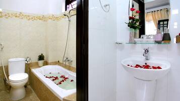 Deluxe Room | Bathroom | Free toiletries, hair dryer, slippers, towels
