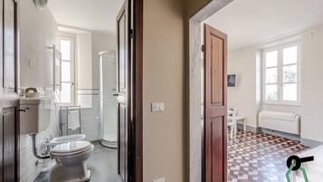 Apartment, 1 Bedroom | Bathroom | Shower, hair dryer, bidet, towels
