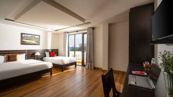 Deluxe Triple Room, Balcony | Minibar, in-room safe, desk, soundproofing