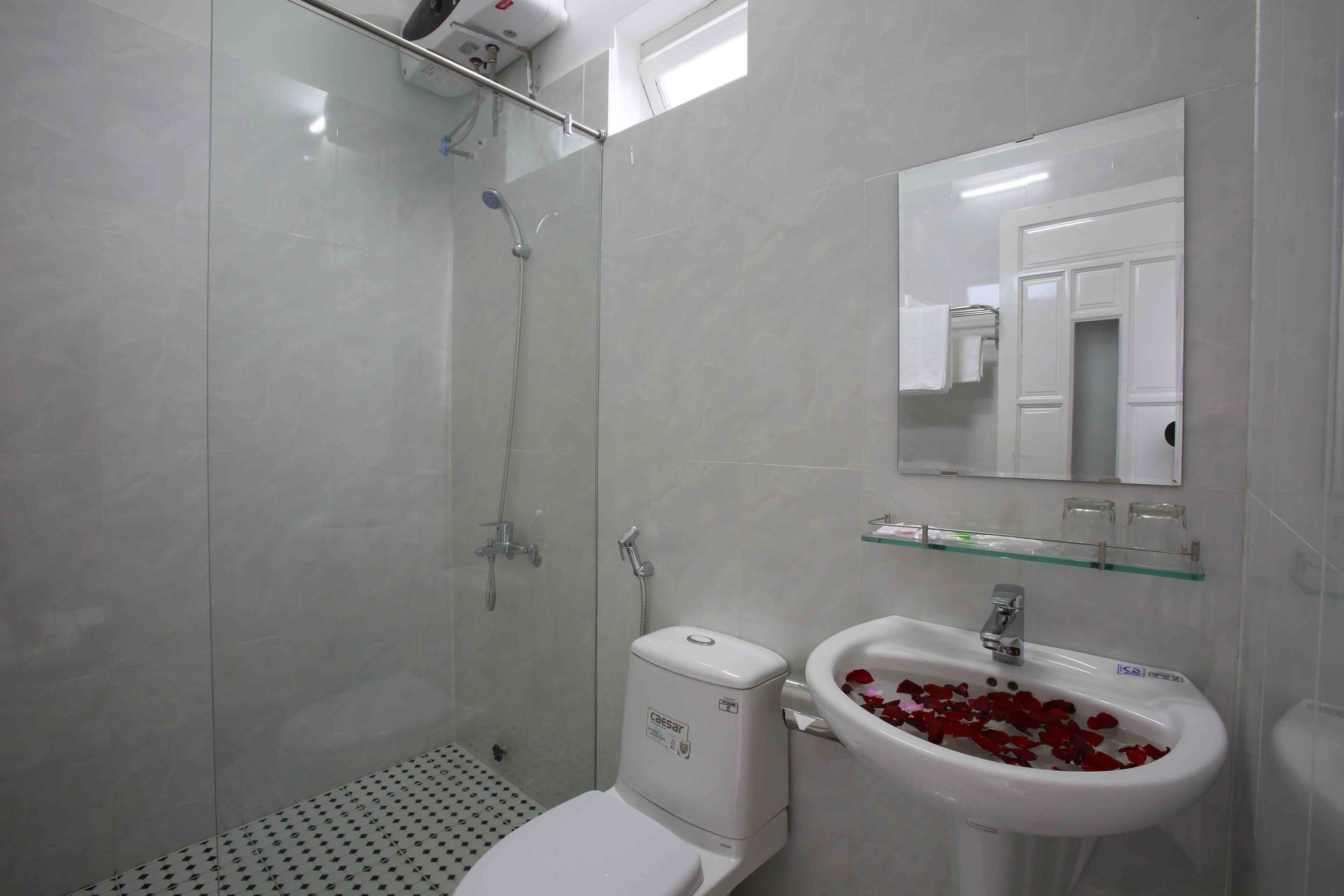 shower, designer toiletries, hair dryer, slippers