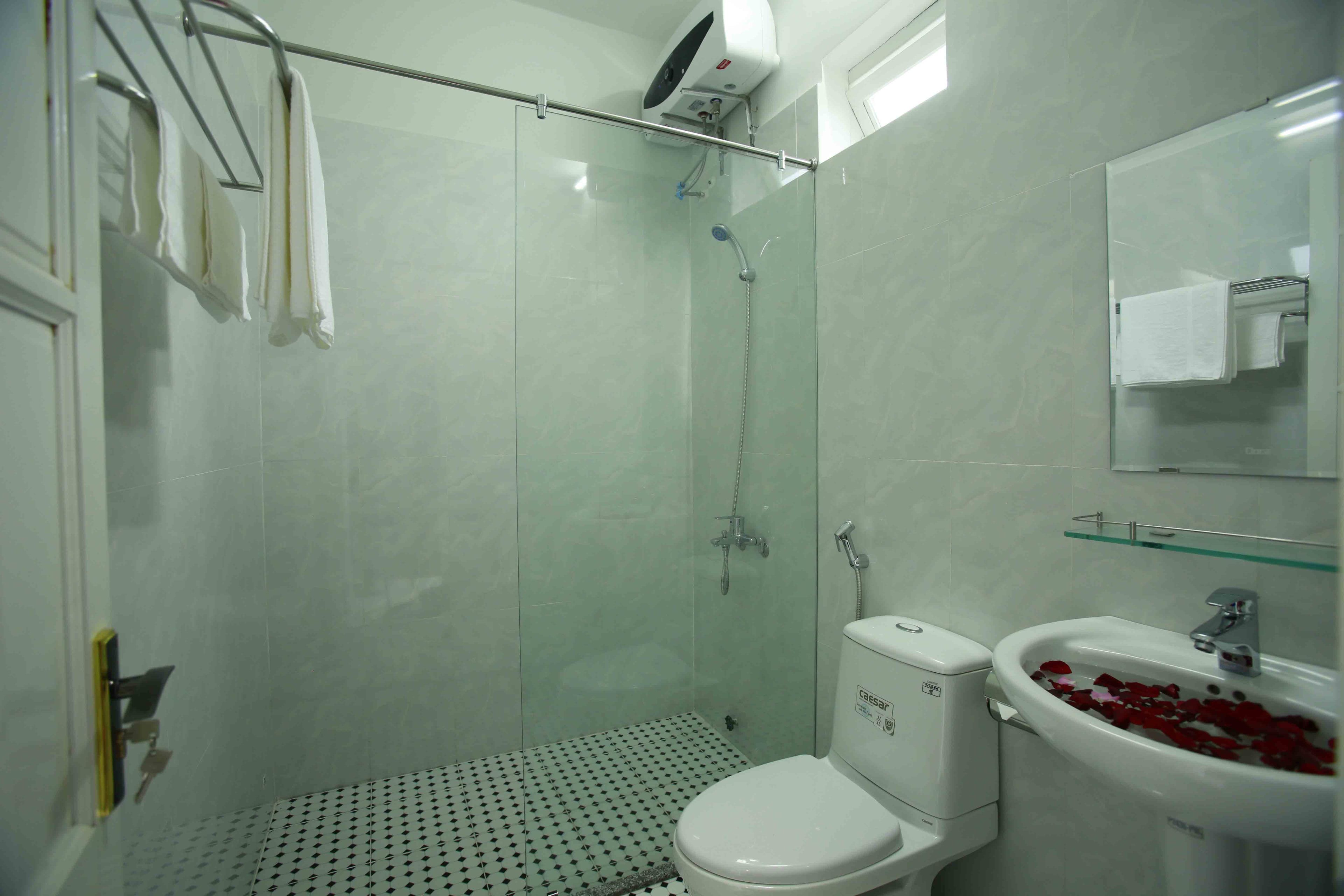 shower, designer toiletries, hair dryer, slippers