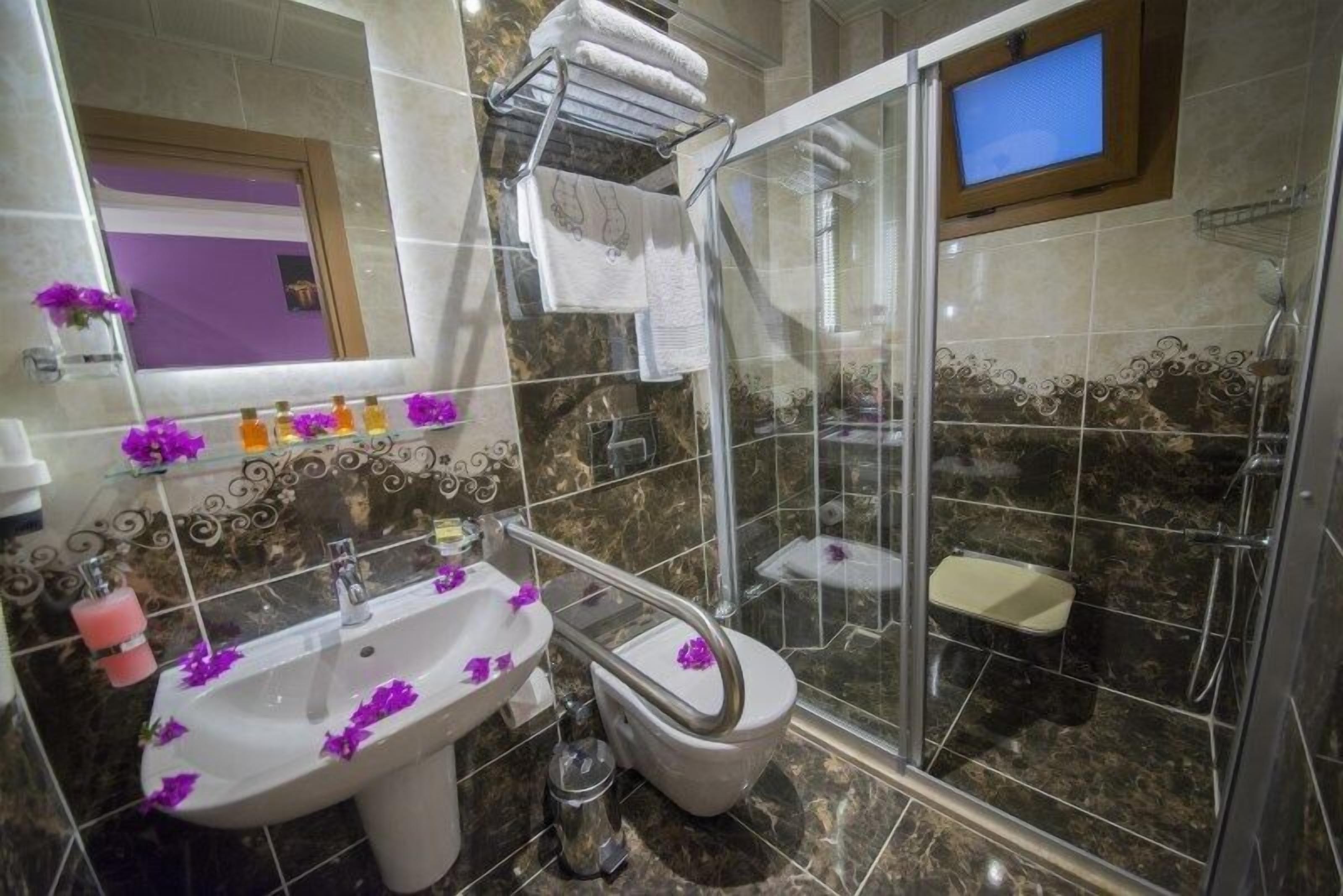 shower, free toiletries, hair dryer, slippers