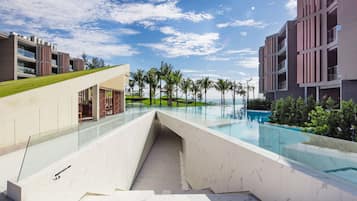Relax by the infinity pool overlooking the surrounding landscape.