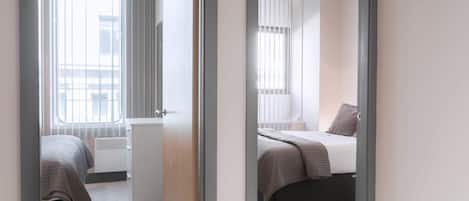 Premium bedding, desk, blackout curtains, iron/ironing board