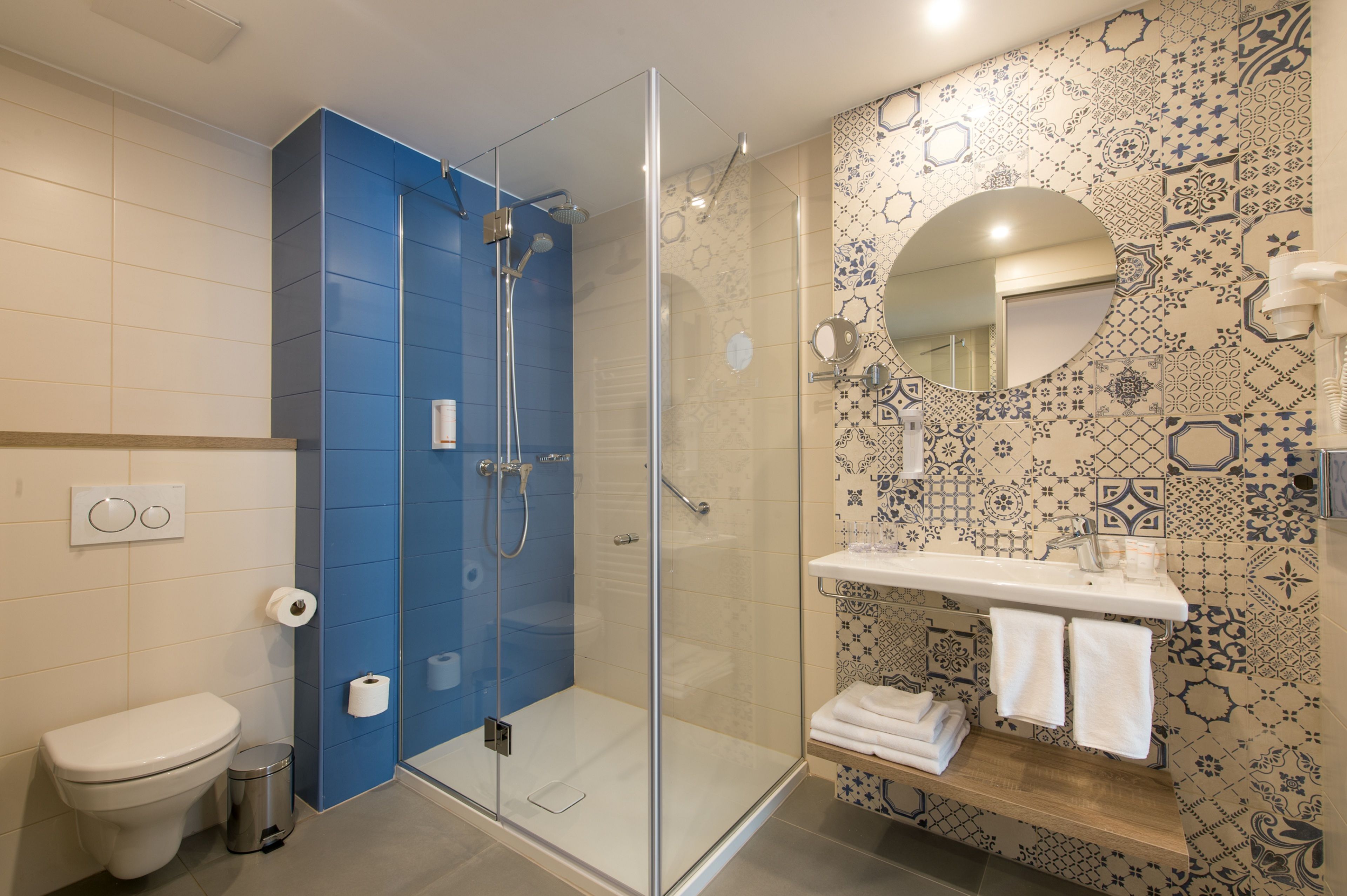 shower, eco-friendly toiletries, hair dryer, towels