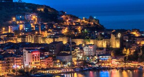 A historic town with a fortified hilltop, waterfront, and various buildings including hotels and restaurants. - Amasra Ceylin Hotel (Amasra)