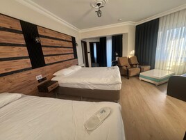 Deluxe Quadruple Room, Non Smoking | Premium bedding, minibar, soundproofing, iron/ironing board (on request)