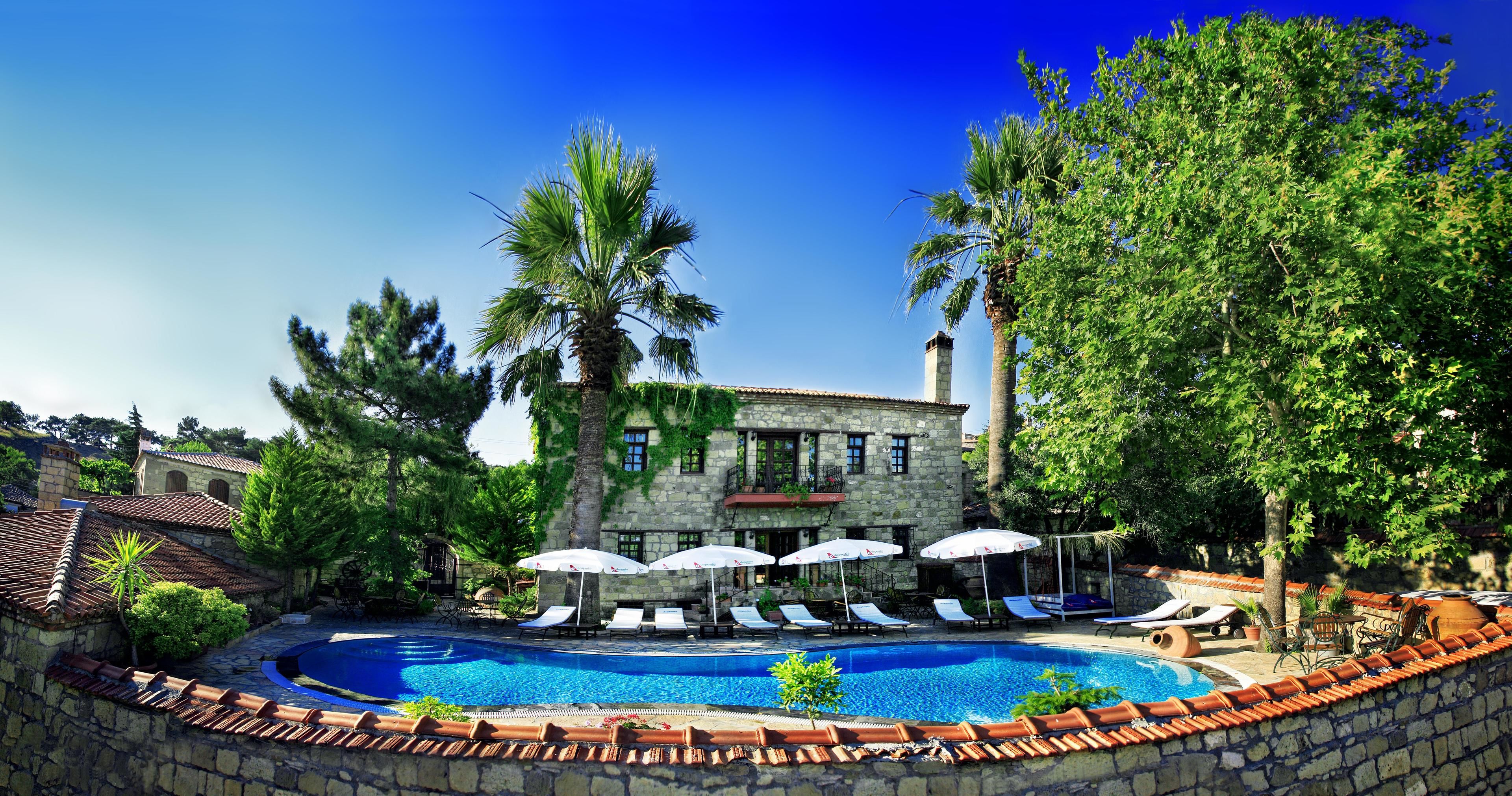 outdoor pool, pool umbrellas, pool loungers