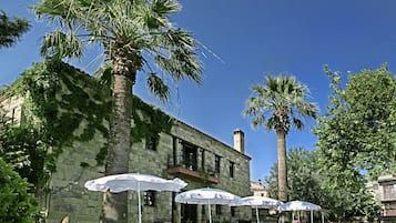 Outdoor pool, open 10:00 AM to 7:00 PM, pool umbrellas, pool loungers