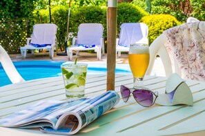Outdoor pool, pool umbrellas, sun loungers