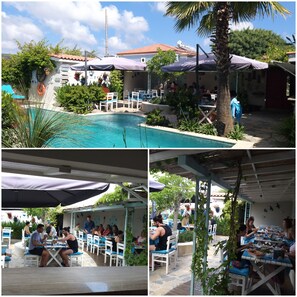 A pool area with a covered seating area and outdoor dining space. - Cassiopeia Hotel Alacati (Cesme)