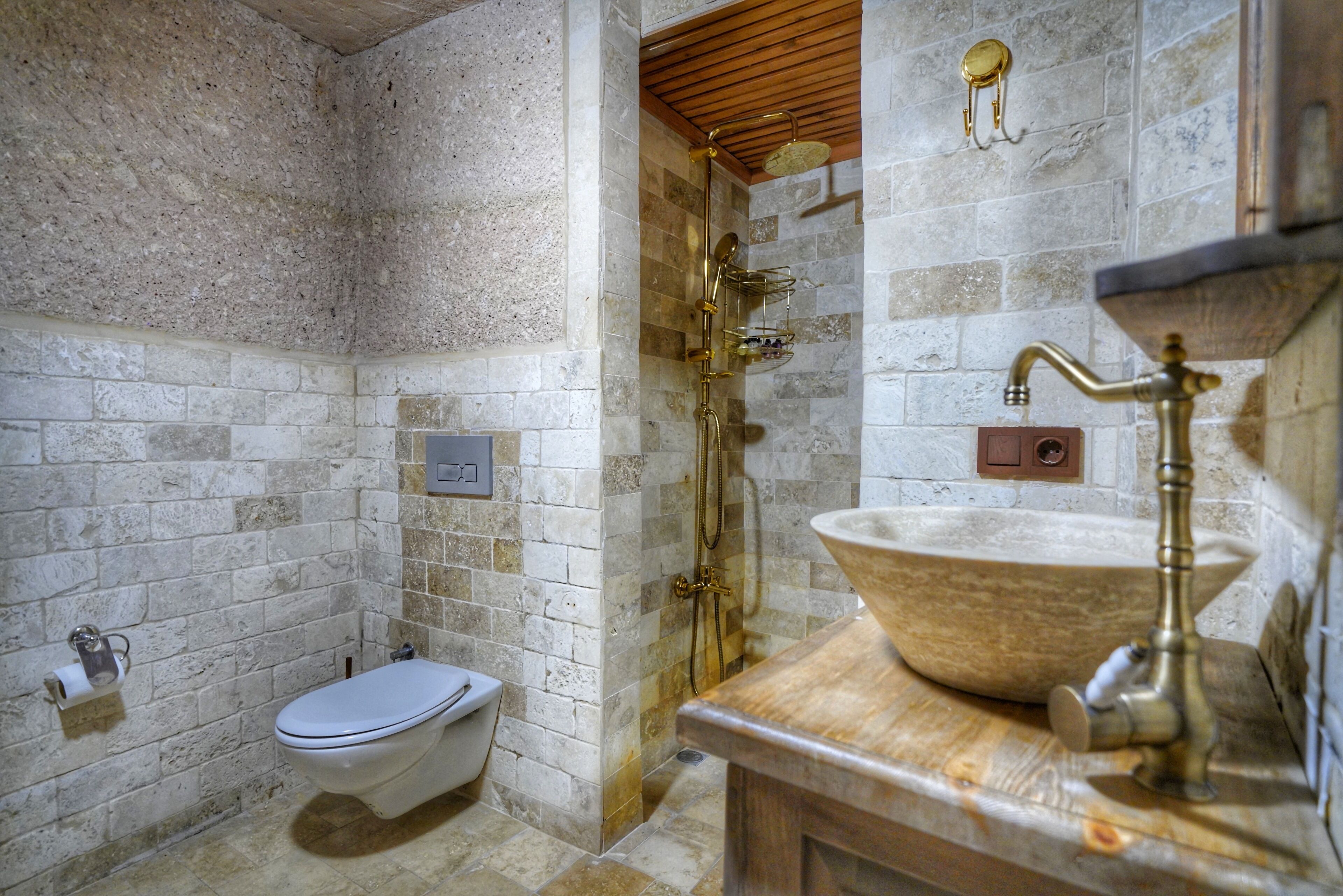 antique cave suite | bathroom | shower, free toiletries, hair dryer, slippers