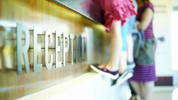 A reception area with a sign that reads "RECEPTION".
