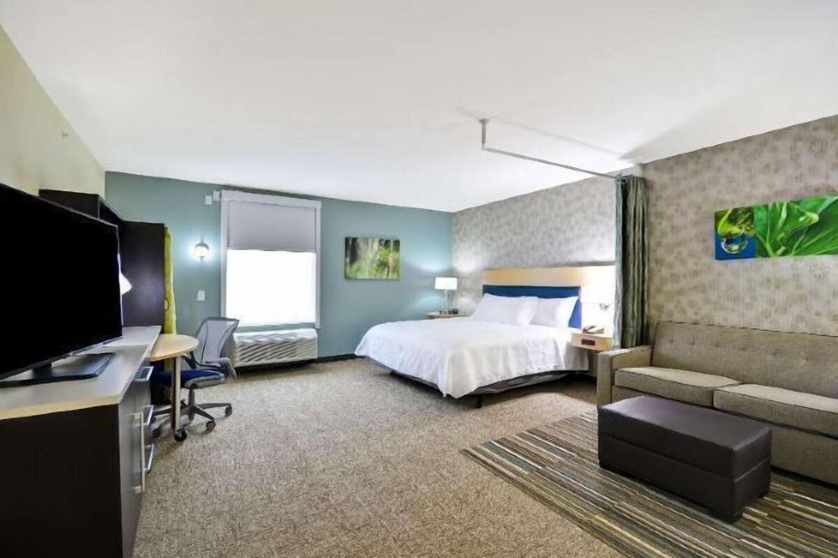 Individually decorated, desk, blackout drapes, iron/ironing board