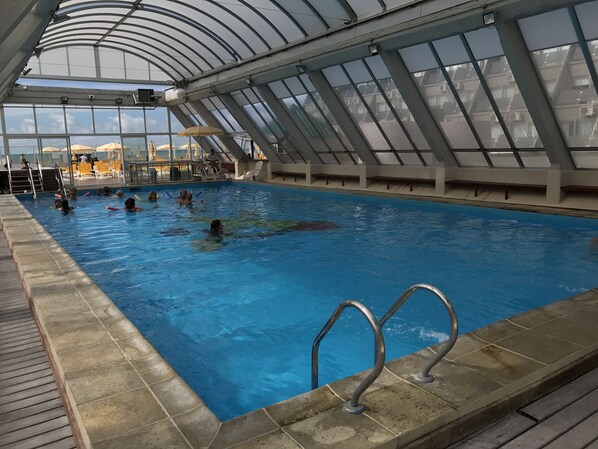 Indoor pool, outdoor pool, pool umbrellas, sun loungers