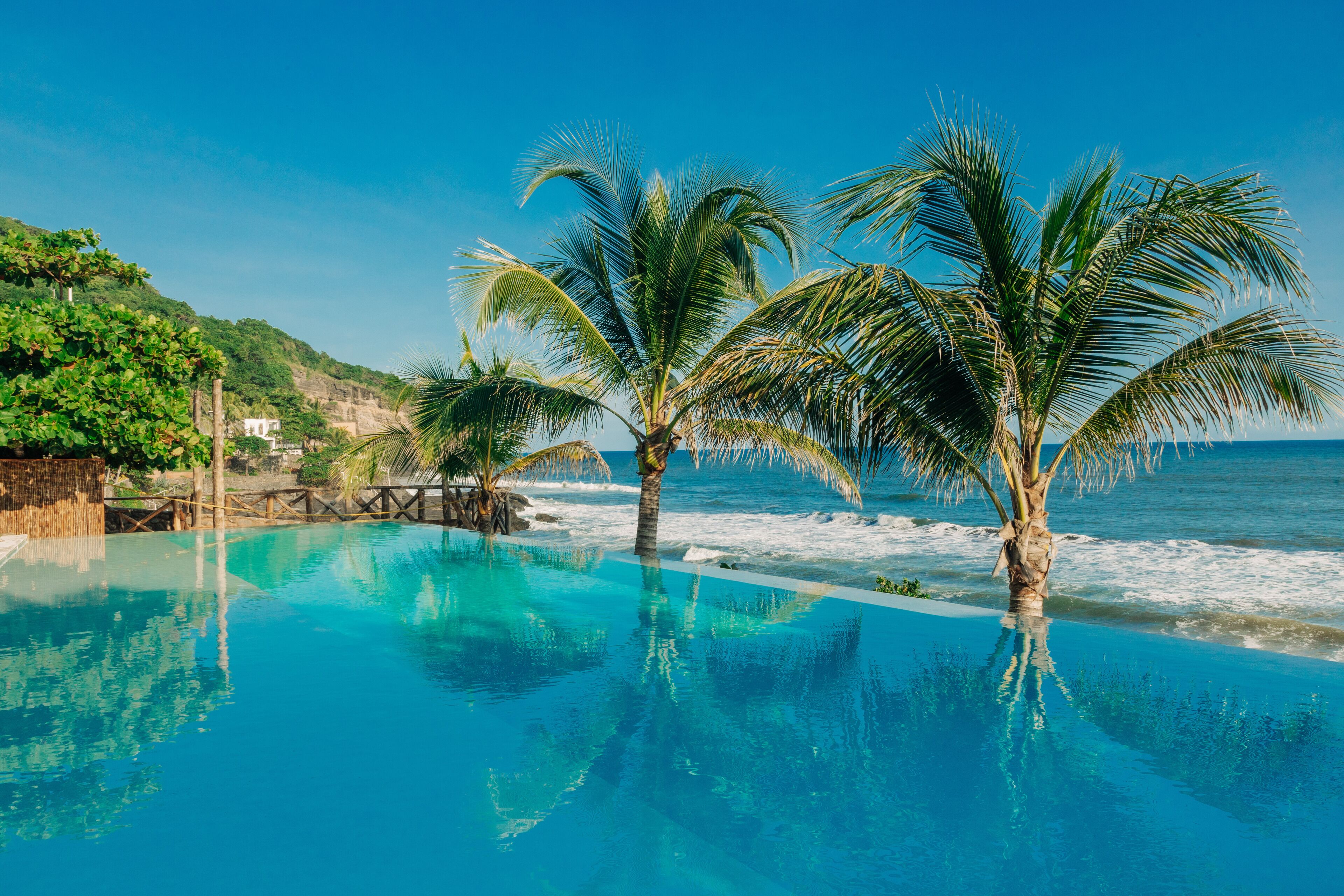 2 outdoor pools, open 6 am to 10 pm, pool loungers