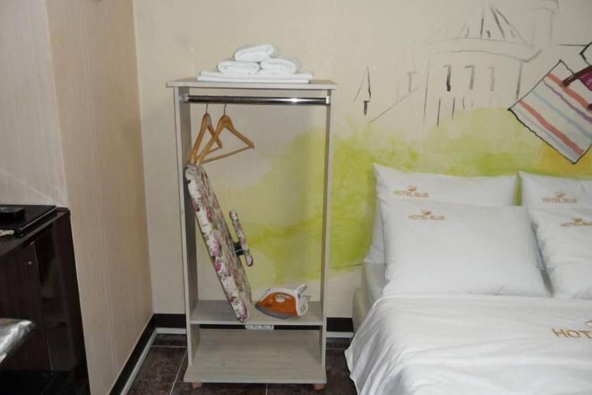 Premium bedding, laptop workspace, blackout curtains, soundproofing