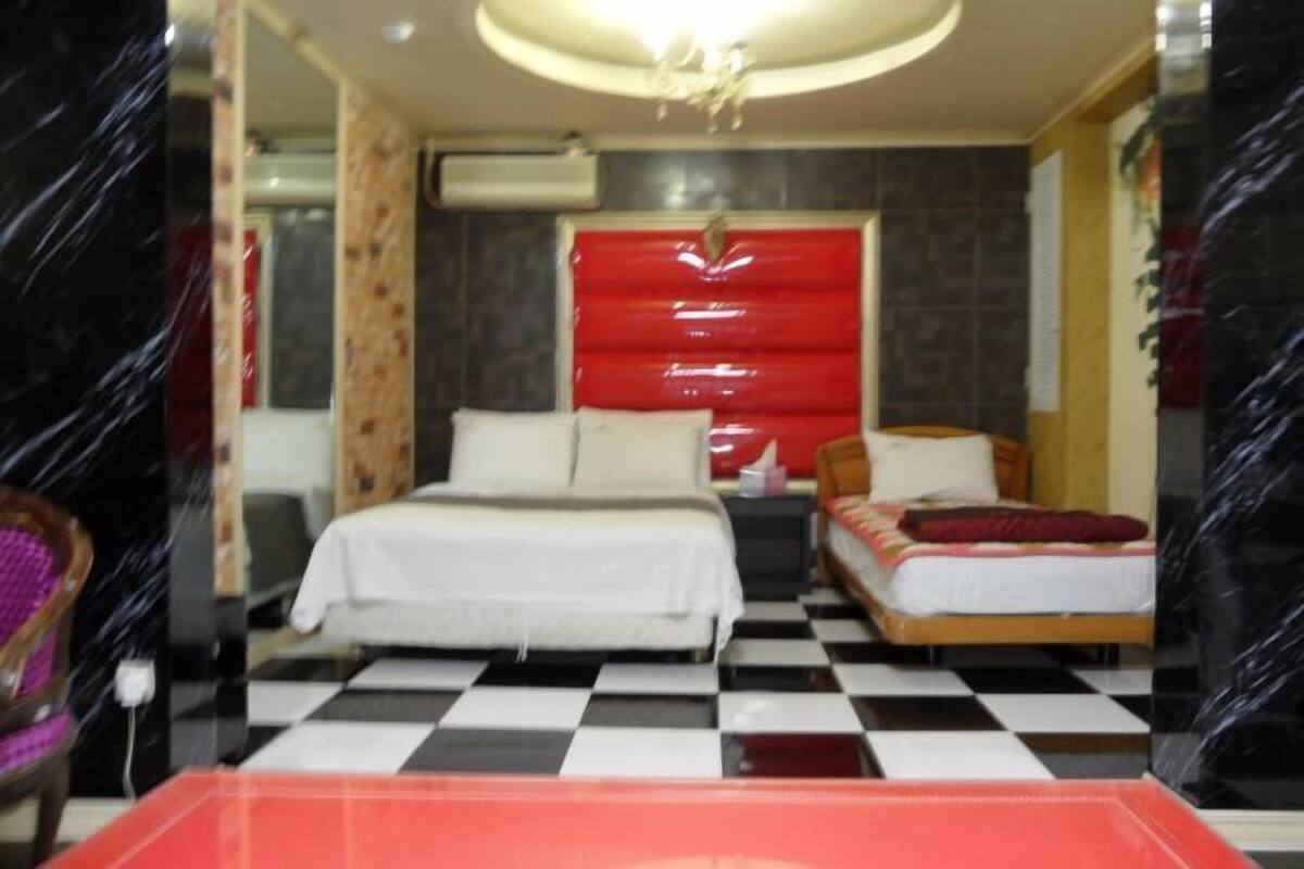 Premium bedding, laptop workspace, blackout curtains, soundproofing