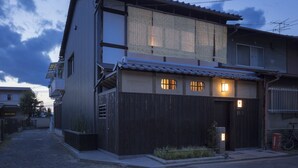 A two-story building with a traditional Japanese architectural style, featuring a wooden facade and tiled roof. - Sanjusangendo Yoitsubaki (Kyoto)