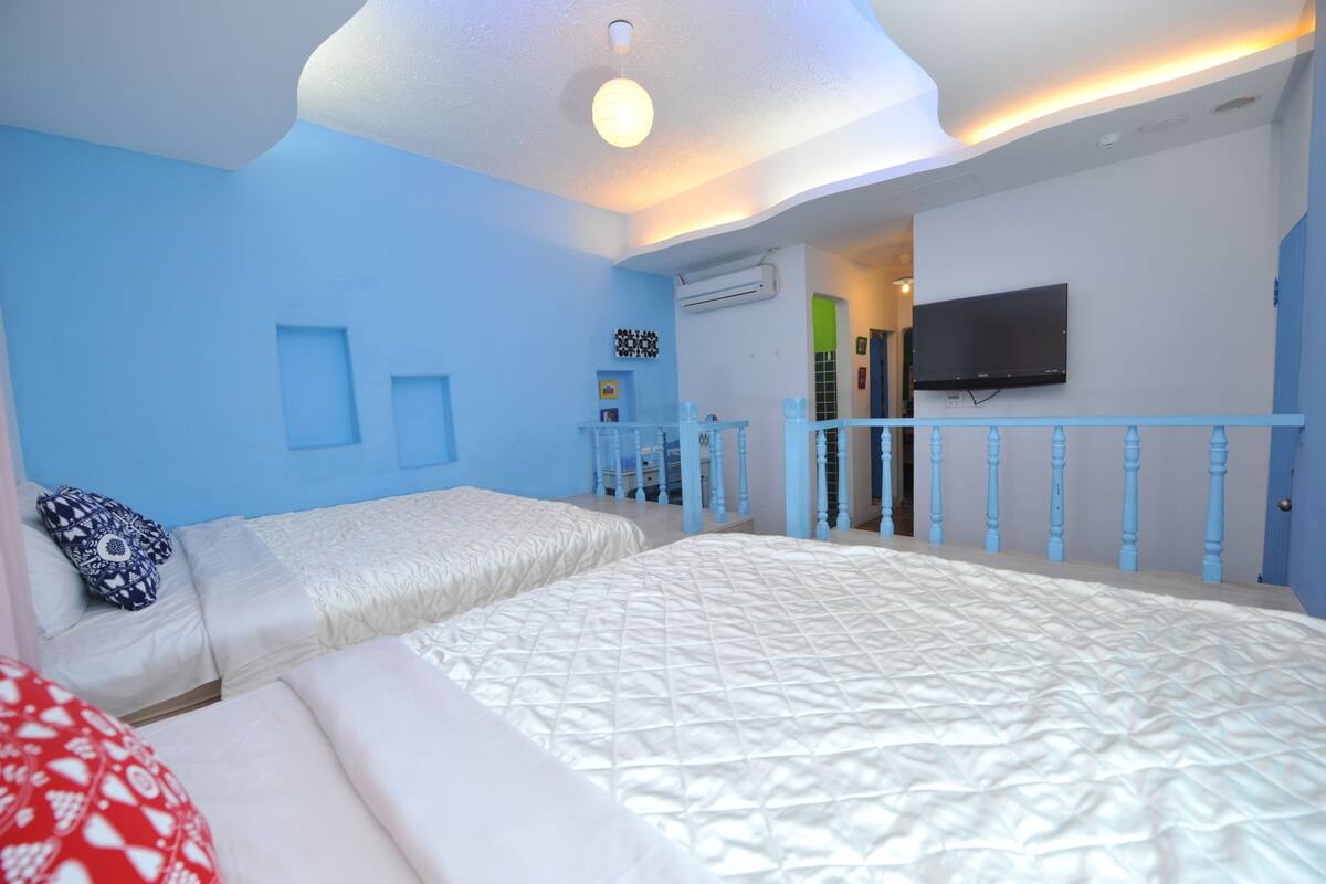 Deluxe Quadruple Room, 2 Queen Beds | Minibar, desk, laptop workspace, blackout drapes