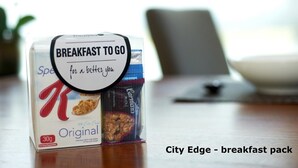 A breakfast pack on a table with a sign that reads "Breakfast to Go for a better you." - Exodus Dandenong Apartment Hotel (Melbourne)