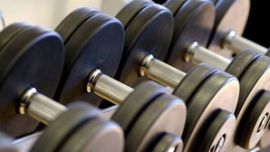 A close-up of a row of dumbbells with weights and metal handles. - Exodus Dandenong Apartment Hotel (Melbourne)