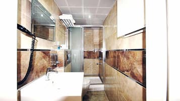 Shower, free toiletries, hair dryer, slippers