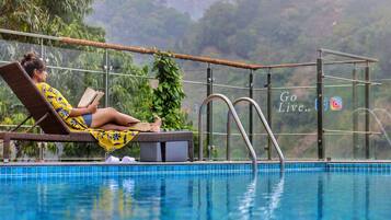 Outdoor pool, open 7:00 AM to 7:00 PM, lifeguards on site