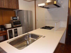 Condo | Private kitchenette | Fridge, microwave, stovetop, coffee/tea maker - Condominium Sango (Chatan)