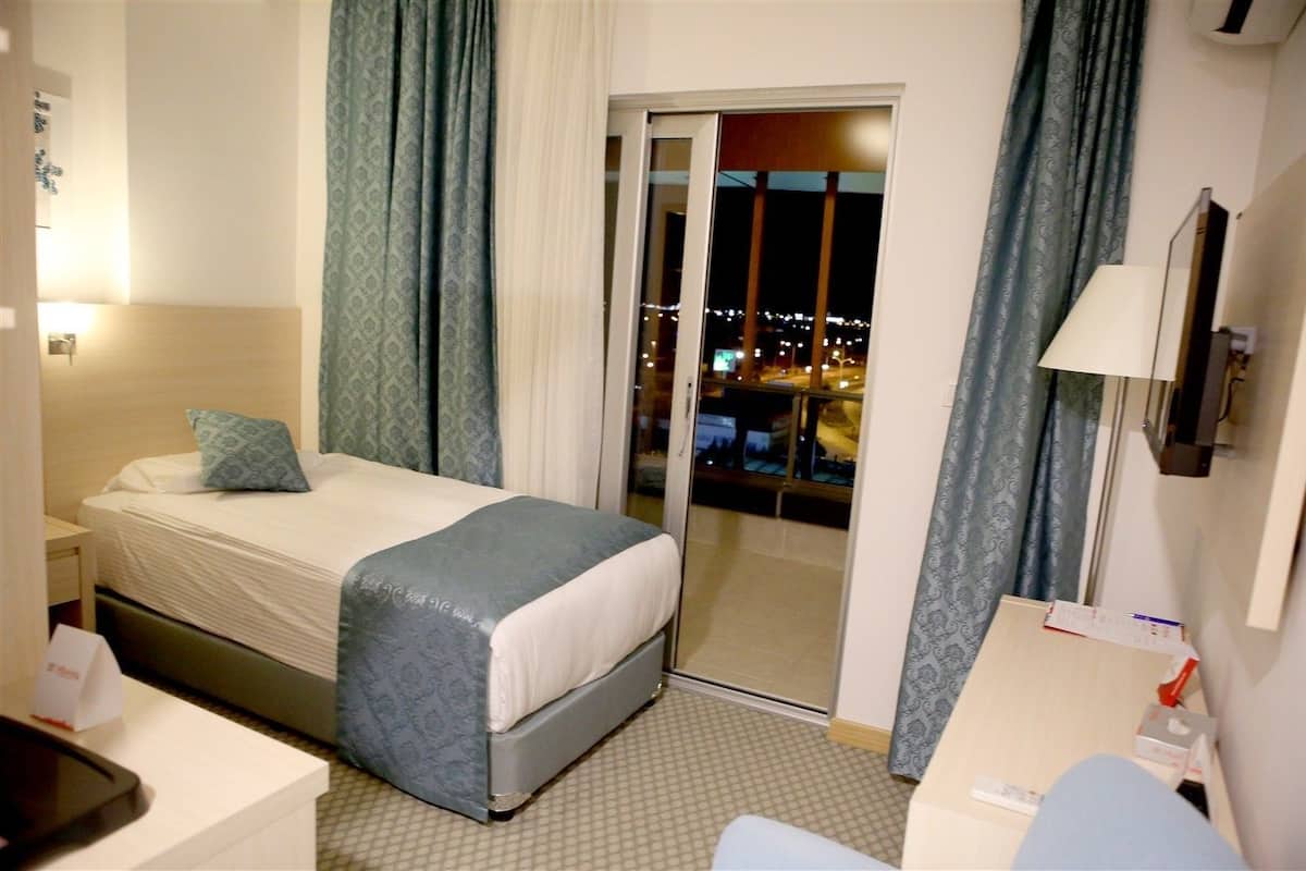 economy single room, city view | premium bedding, free minibar items, in-room safe, desk