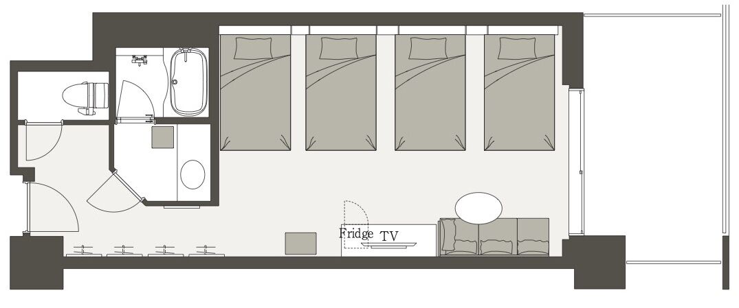 A floor plan of a hotel room with a bathroom, a sitting area with a TV, and a bed.