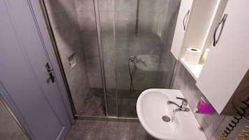 Shower, free toiletries, hair dryer, slippers