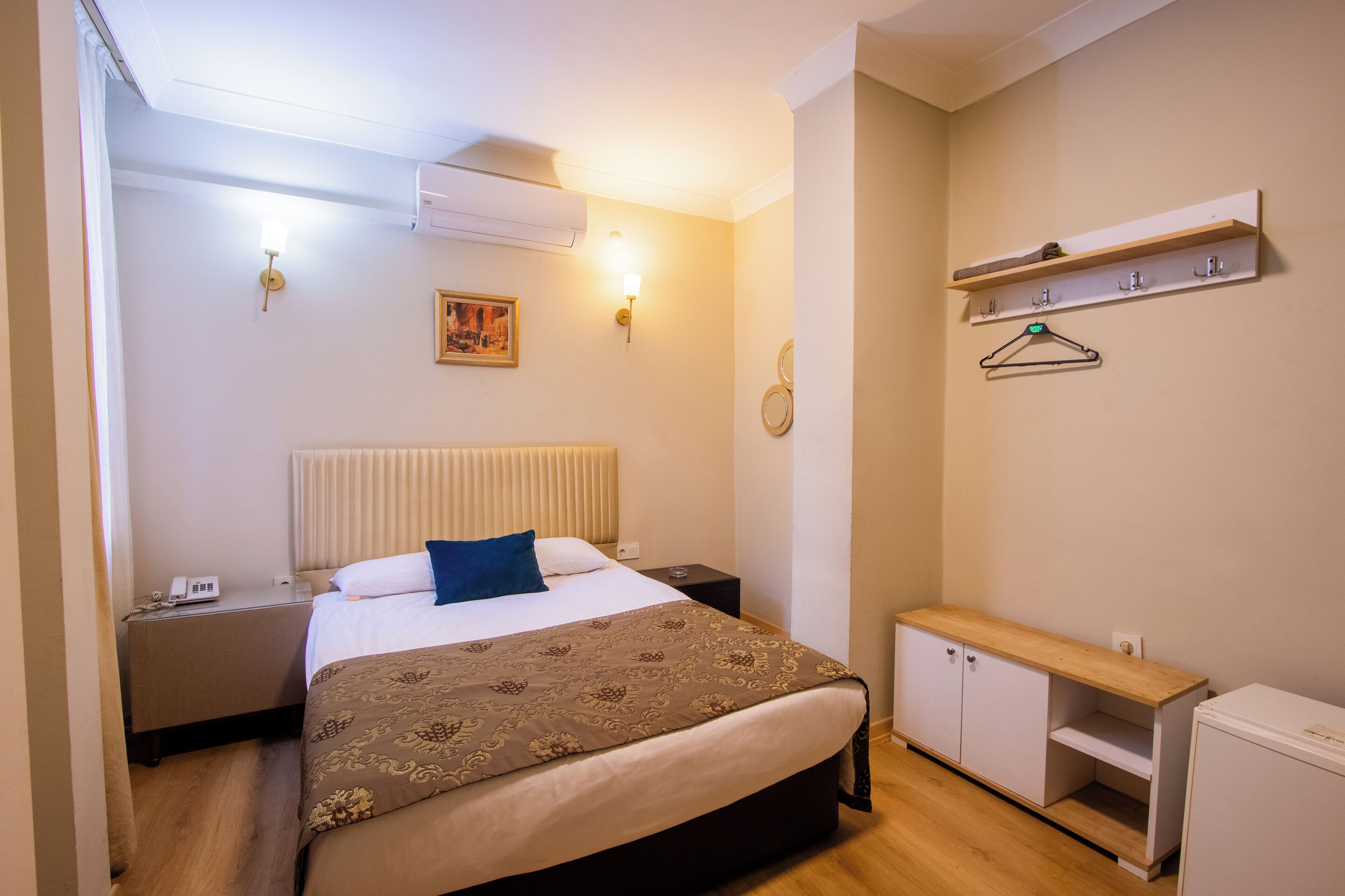 Economy Double Room | Minibar, in-room safe, desk, laptop workspace