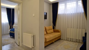 Deluxe Family Apartment | Living area | 32-inch LCD TV with satellite channels, TV - Blue Mosque Suites (Istanbul)