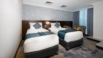 Kamer, 1 twee- of 2 eenpersoonsbedden | Een minibar, een kluis op de kamer, geluiddichte muren