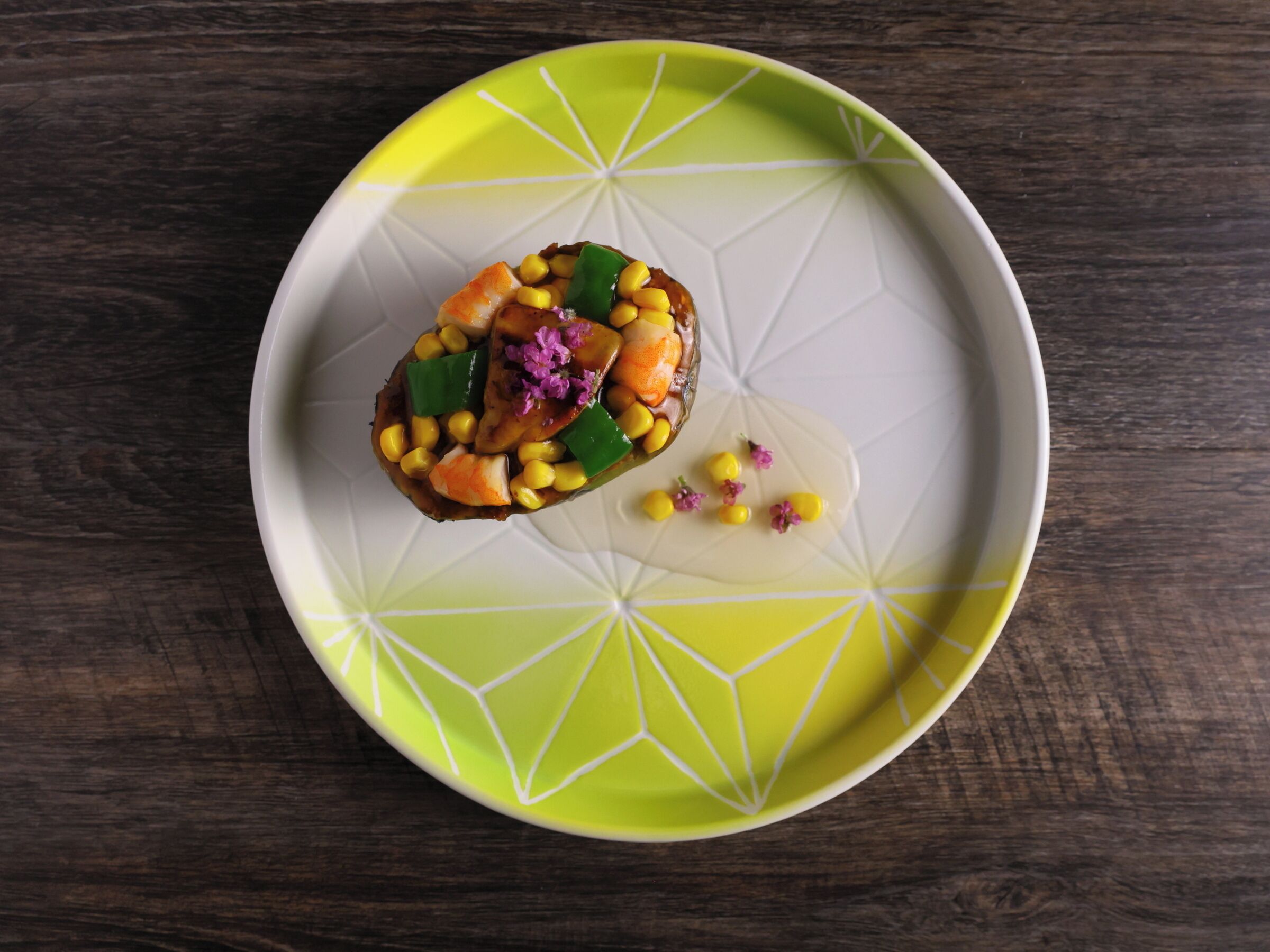 A plate with a food item on a geometric-patterned plate.
